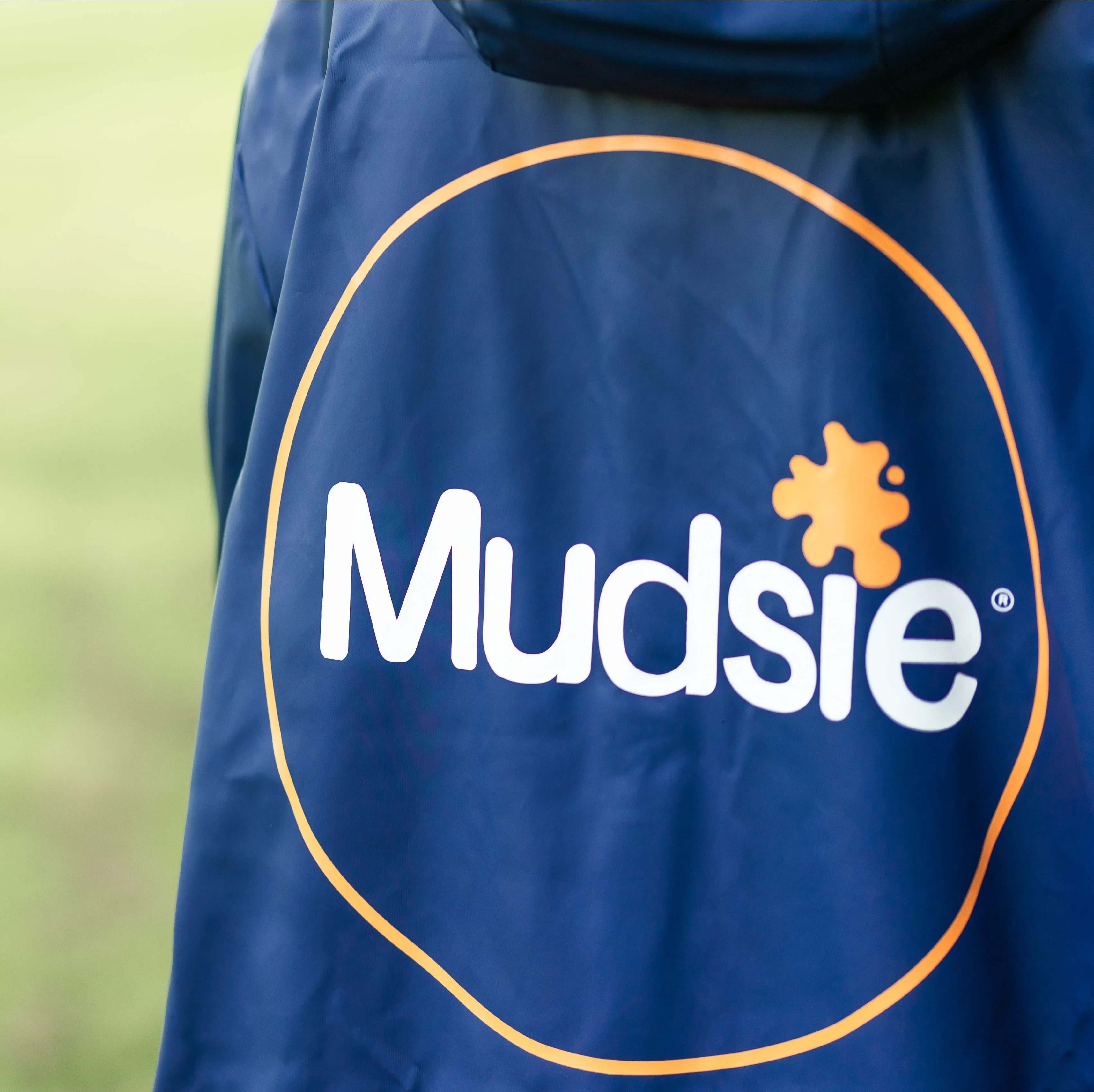 ORANGE LOGO MUDSIE COAT