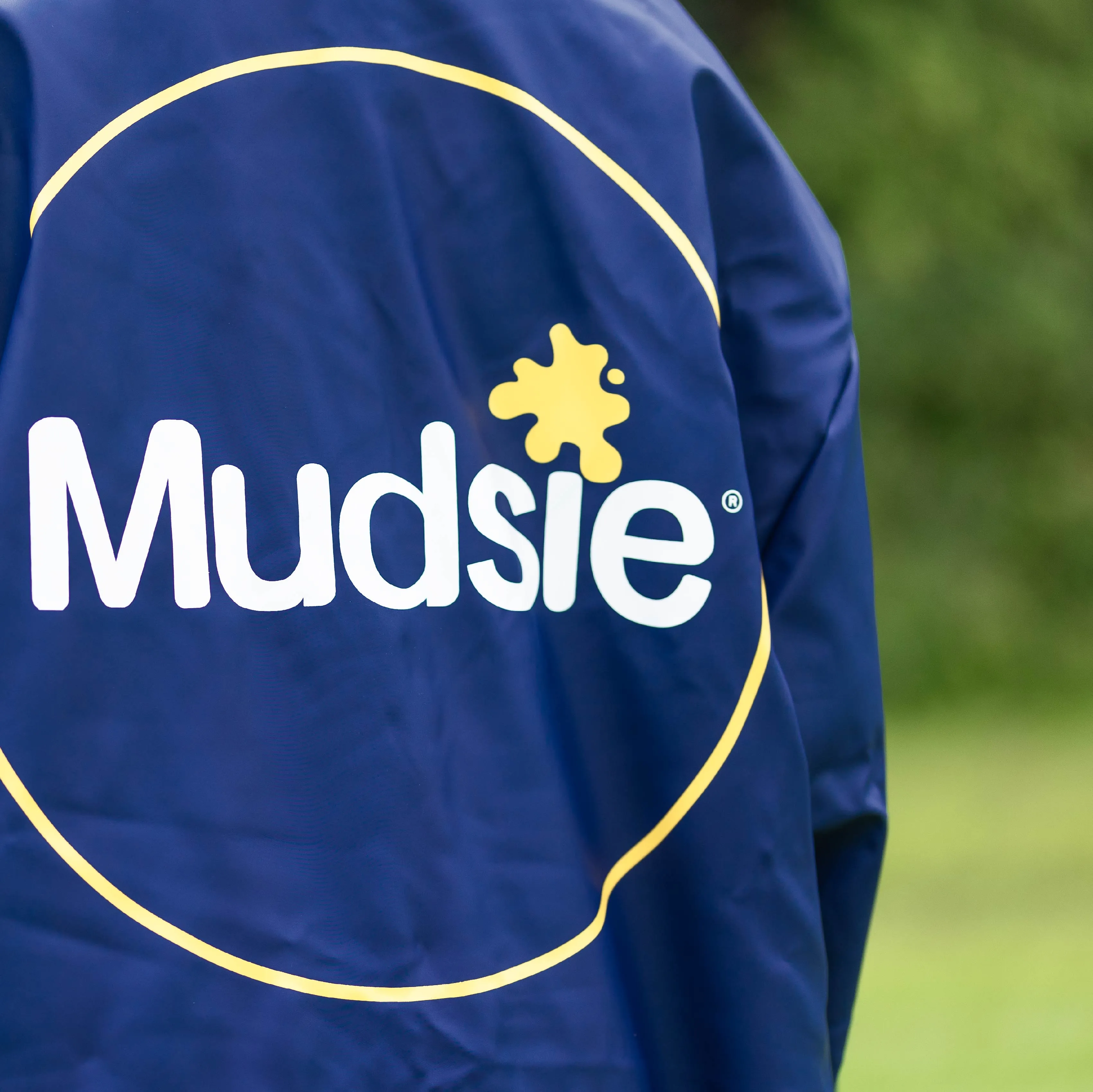 YELLOW LOGO MUDSIE COAT